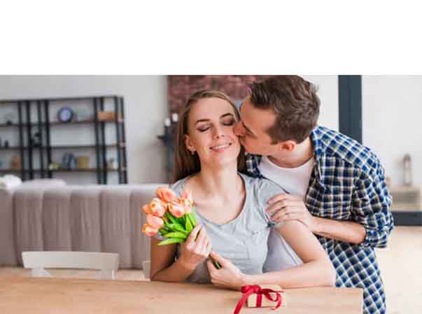 Man giving gift to wife on 1st anniversary